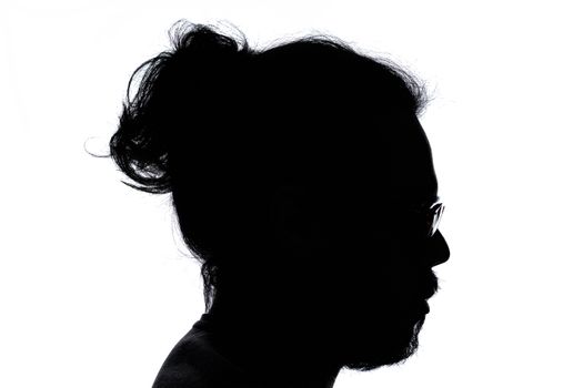 Artistic silhouette of a man's profile with glasses against a white background.